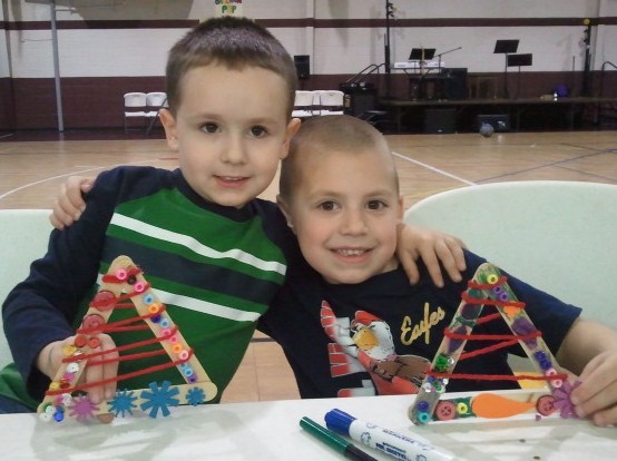 Jackson (right) is with his cousin Evan showing off their Christmas tree creations