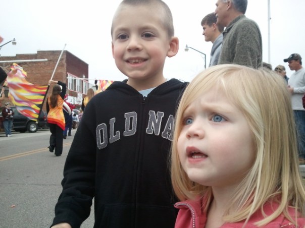 Jackson and Lauren look eagerly at the next parade float, hoping to catch more candy.