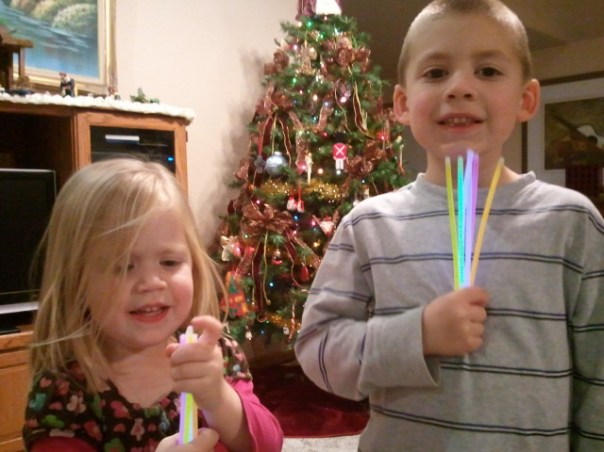 Lauren and Jackson can't wait to turn out the lights to play with their glow sticks.