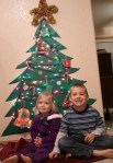 Lauren and Jackson sit under the paper tree.