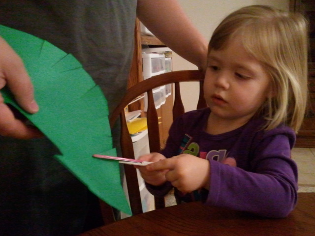 Lauren cuts her palm branch.