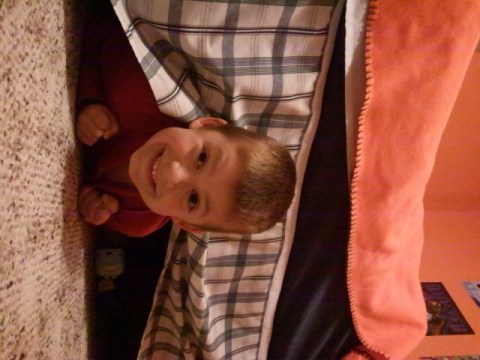 Jackson hides under his bed during our Hide and Go Seek game