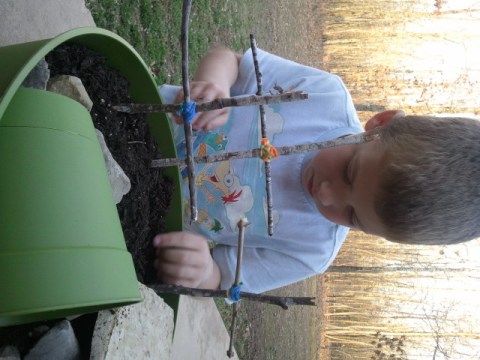 Jackson finds a good spot to plant his morning glory seeds.