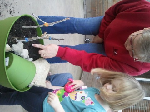 Grandma helped Lauren find a good spot to plant her seeds.