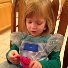 Lauren sews her ornament