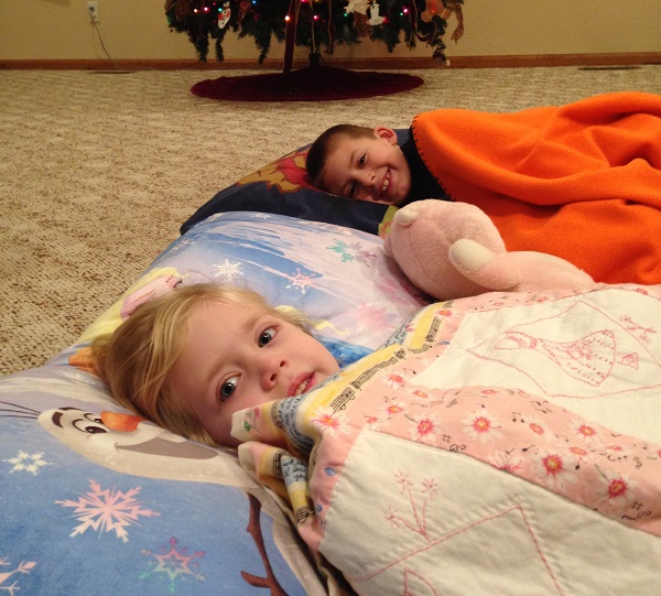 The kids created comfy beds in the living room to think about what it would be like to trade comfort to serve Christ. 