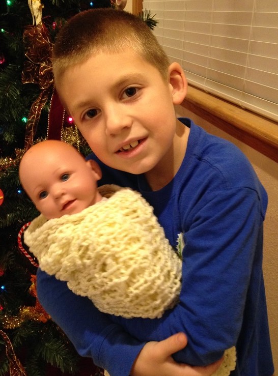 Jackson holds the baby after searching for it in our game tonight.