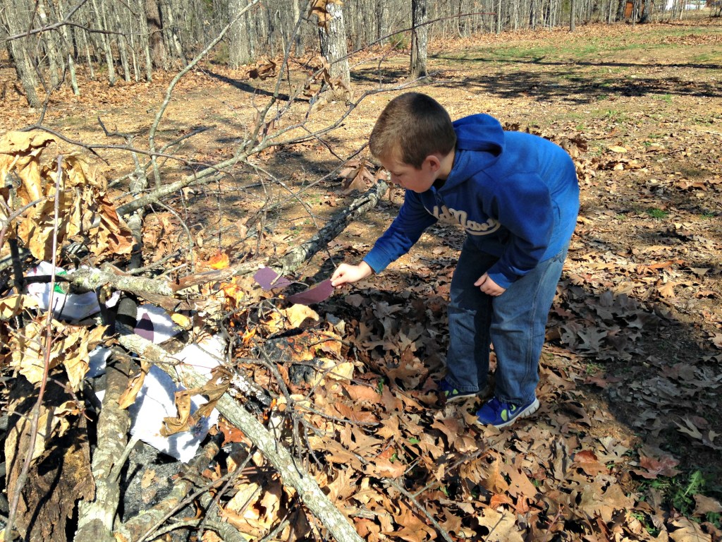 Jackson places his "sin" in the flames of the burn pile. He got a little too close for this mama's comfort! Like father, like son. :)