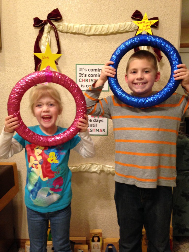 The kids hold up their Advent wreaths, where we will add different names of Jesus from Scripture during the month. 